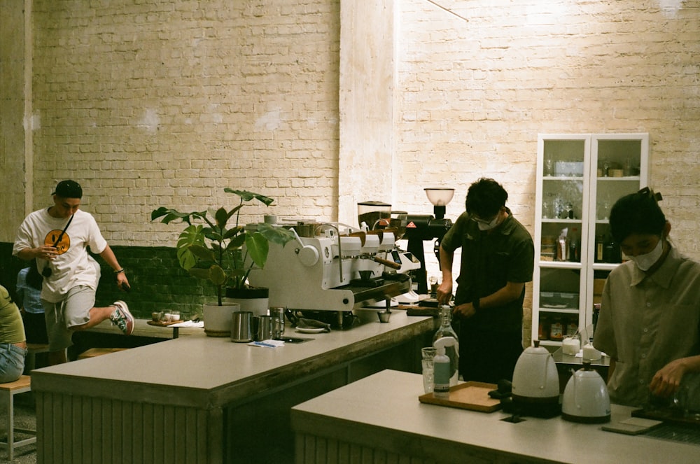 a group of people working in a coffee shop