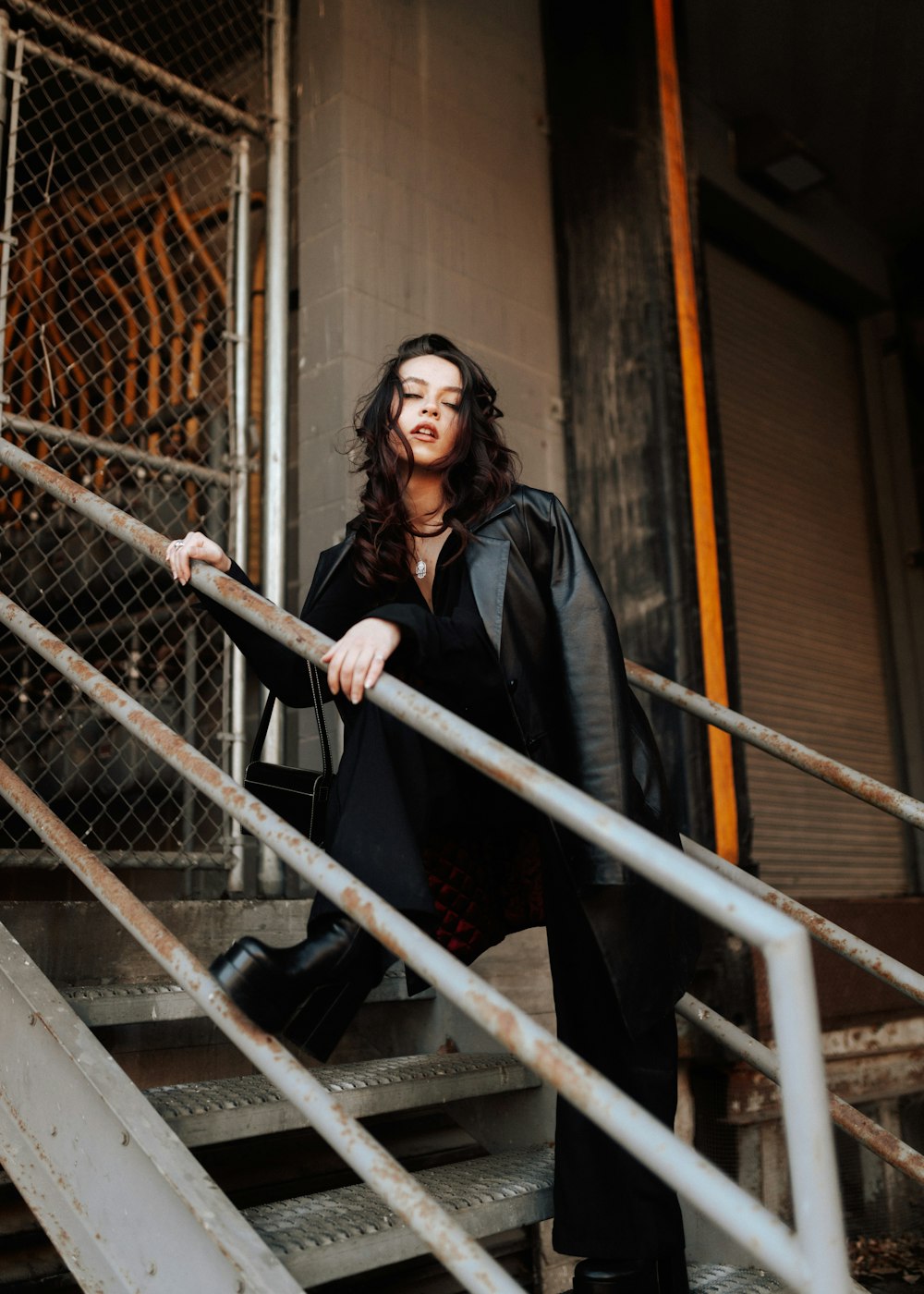 a woman standing on a set of stairs