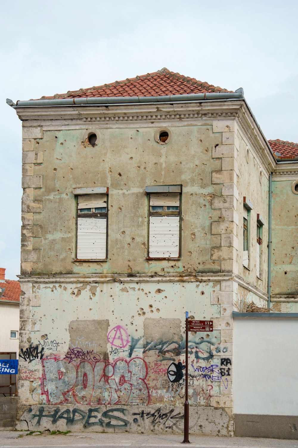 an old building with graffiti on the side of it