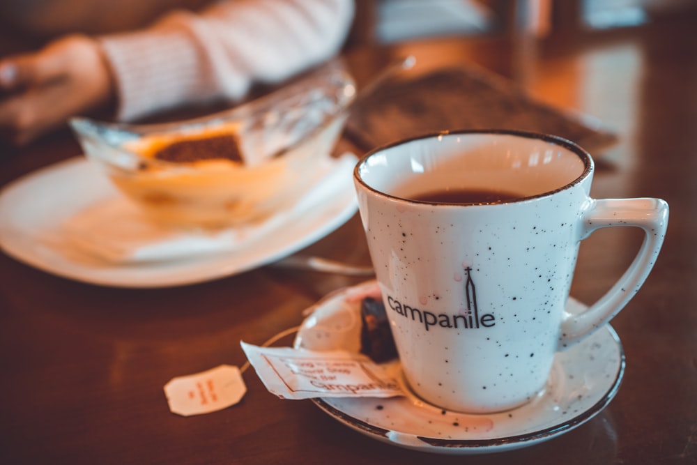 a cup of coffee sitting on top of a saucer