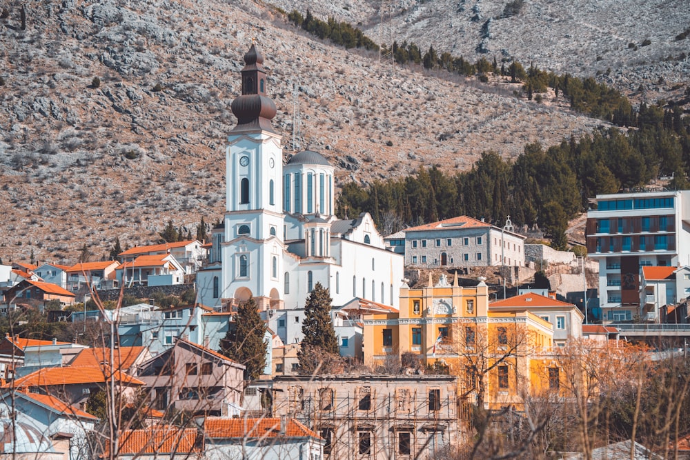 a city with a church on top of a hill