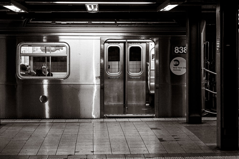 a subway car with its doors open at night