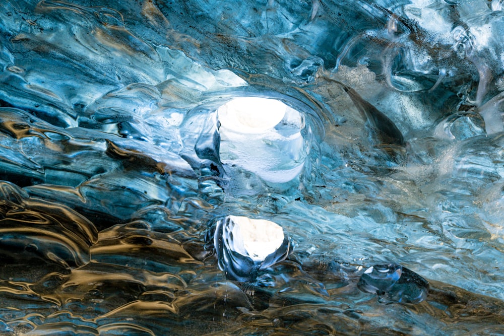 a close up of water and ice on a surface