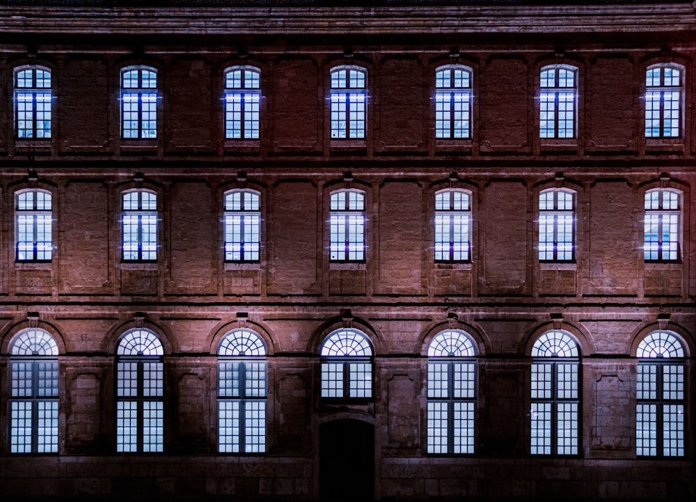 a large building with many windows lit up at night