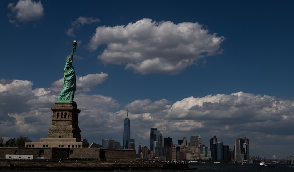 a view of the statue of liberty from across the water