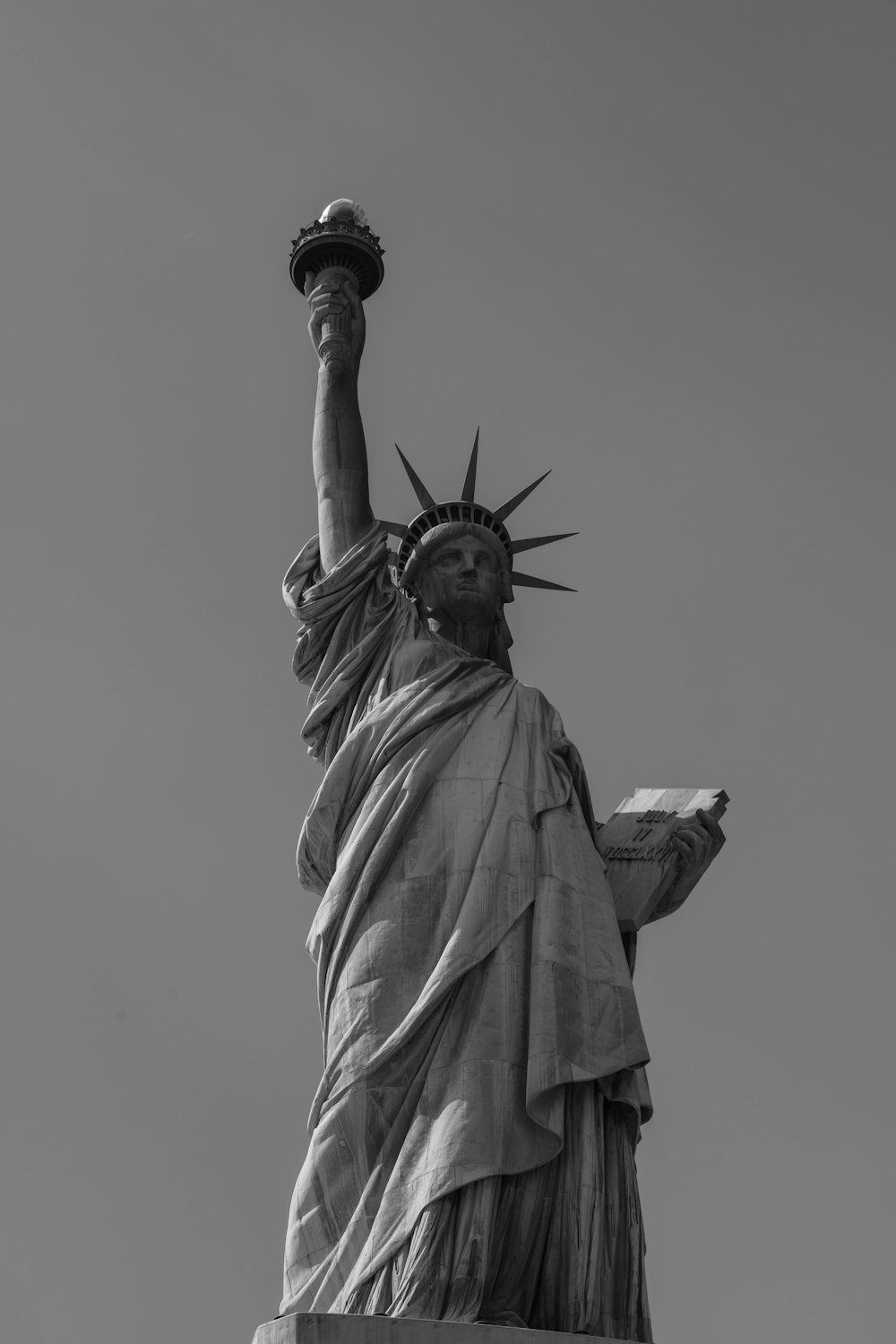 a black and white photo of the statue of liberty