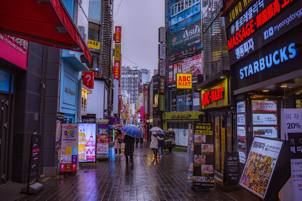 Walking through a Seoul street in the rain