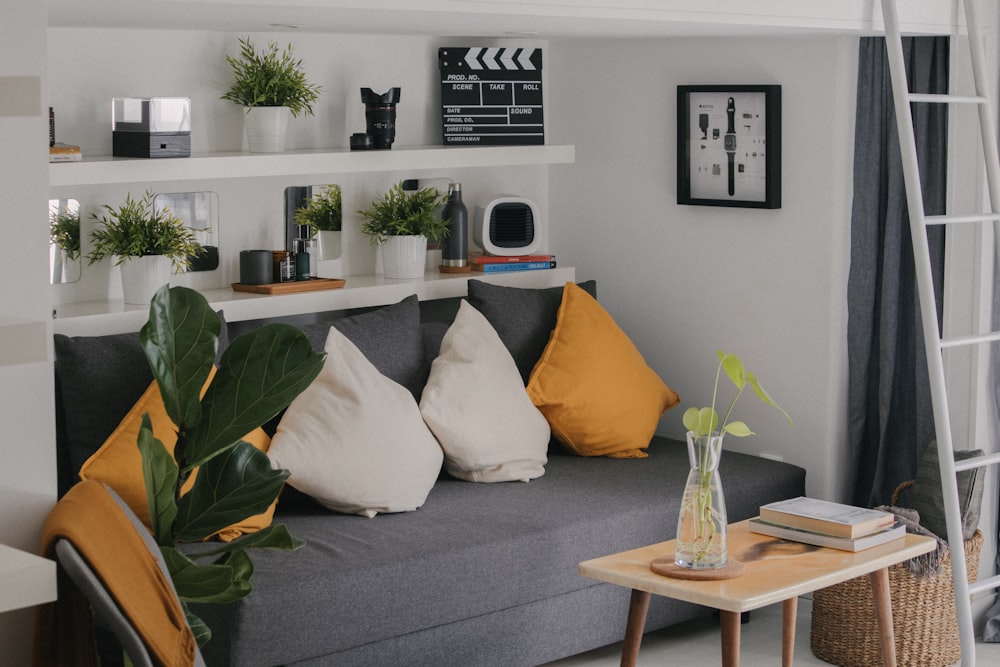 a living room filled with furniture and a ladder