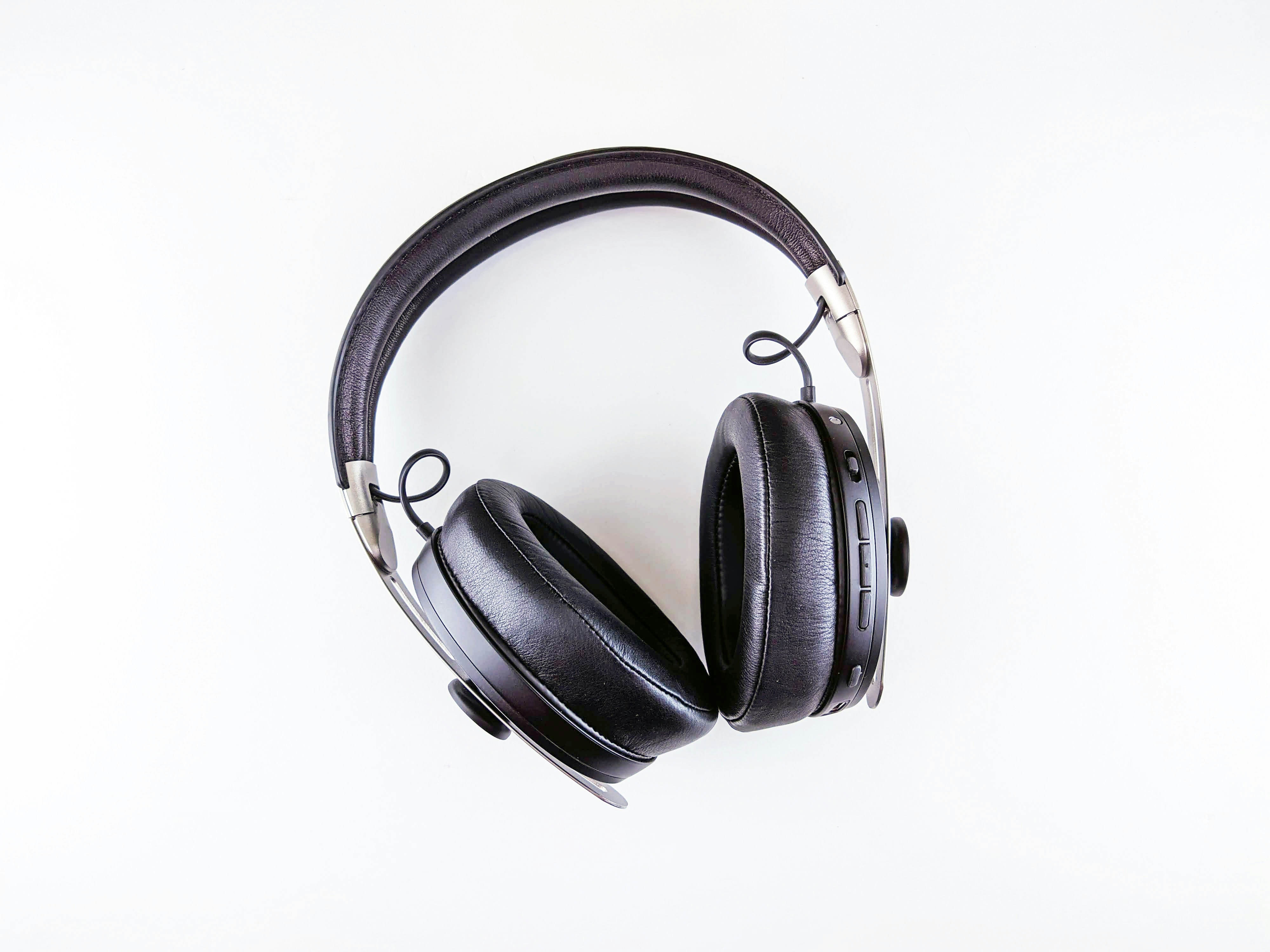 Bose over-ear headphones in white and silver on dark background