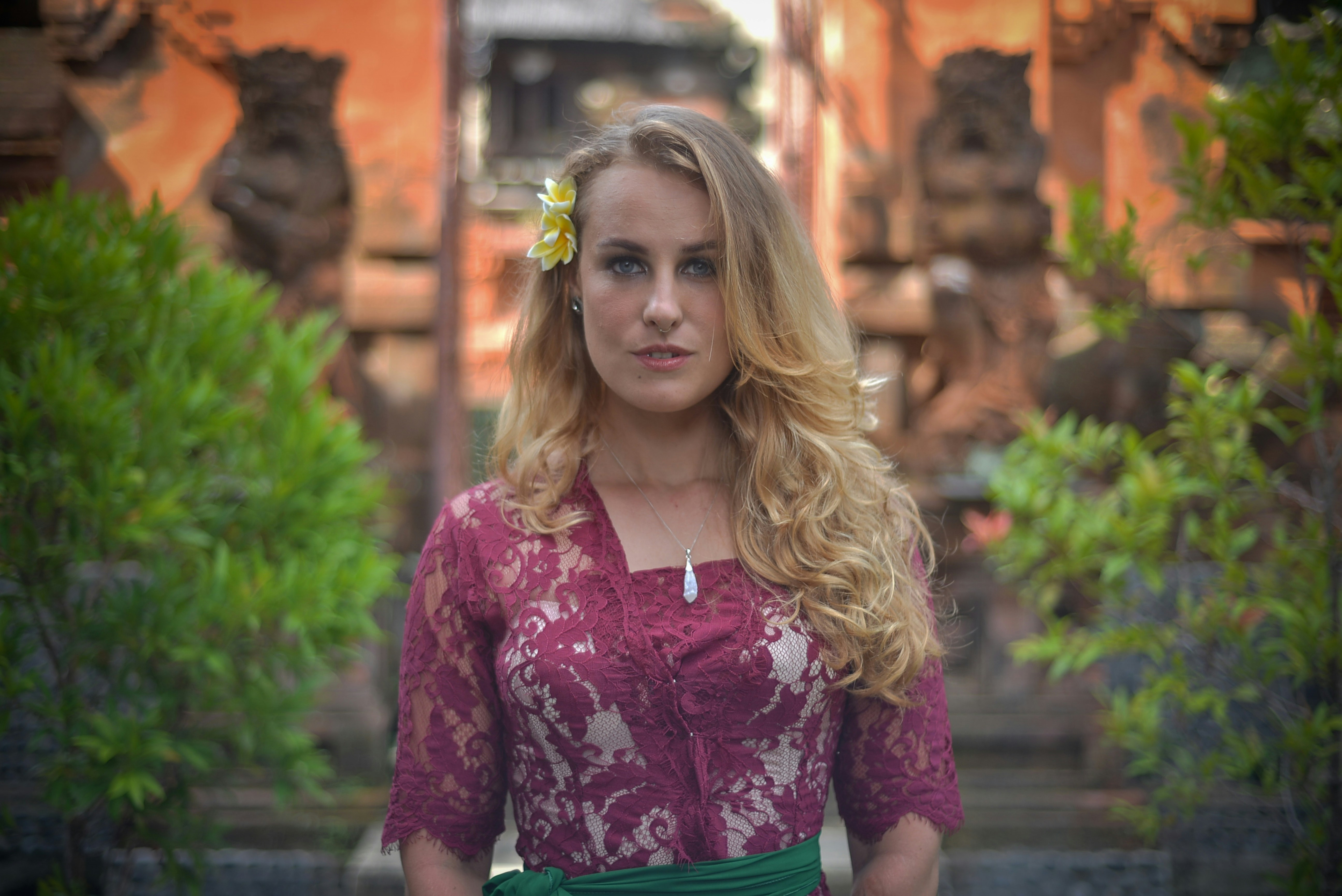 a woman with a flower in her hair