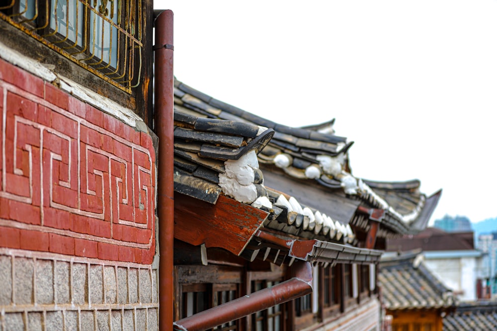 a row of red and white buildings next to each other