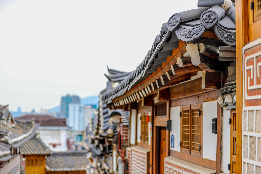 a row of buildings with a city in the background