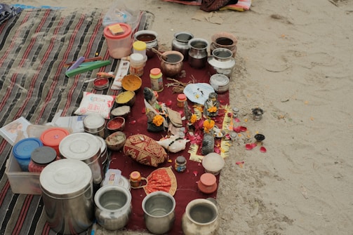 Close-up of ritual items like flowers, incense, and holy water.