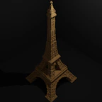 A detailed 3D puzzle of a famous landmark assembled on a desk with puzzle pieces scattered around.