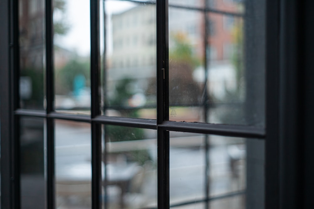 a close up of a window with a view of a street