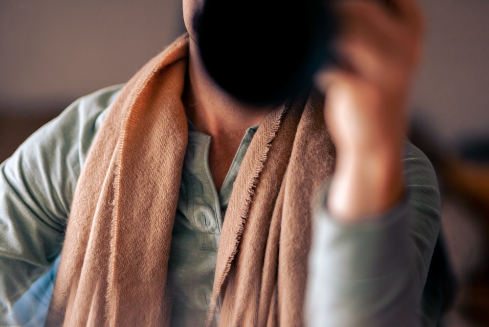 a woman with a scarf around her neck