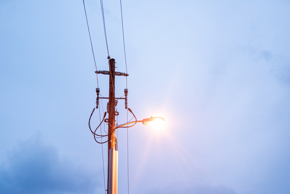 a street light on a pole with a sky background