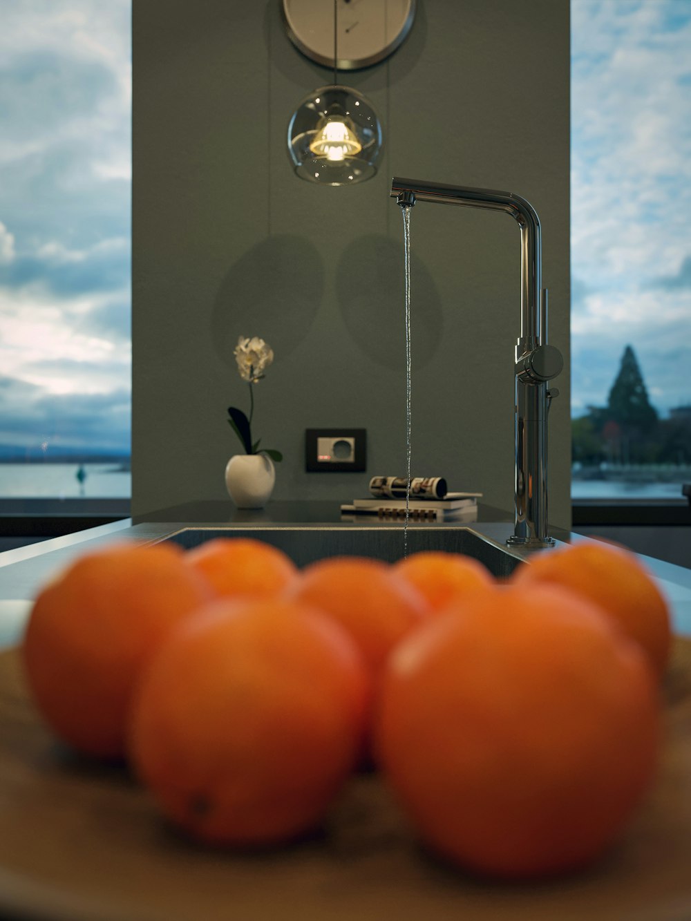 a plate of oranges sitting on a kitchen counter