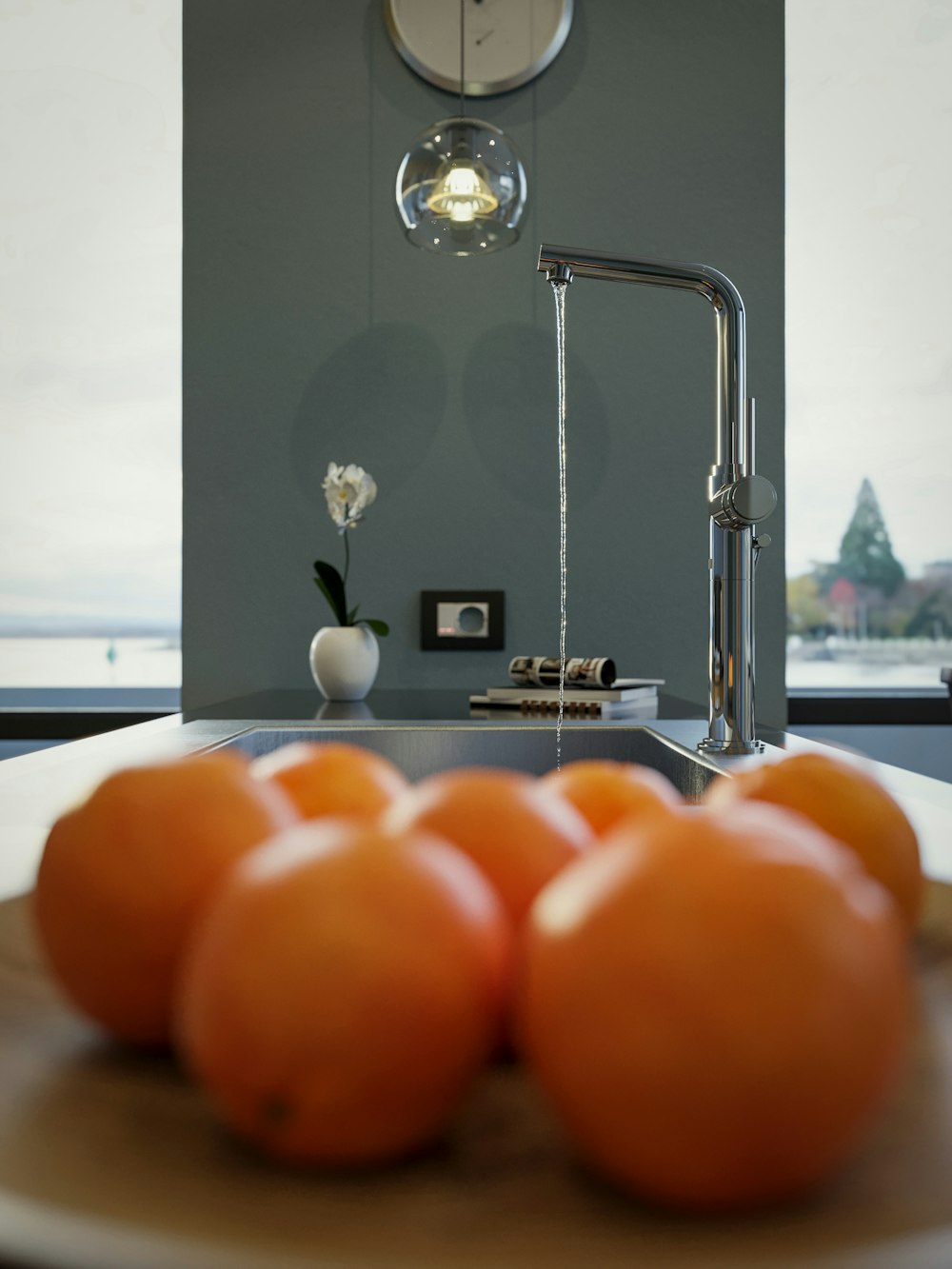 a bunch of oranges on a plate in a kitchen