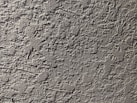 a close up of a cement wall with cracks