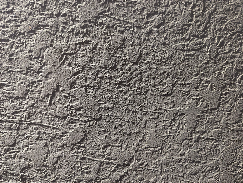 Cracked plaster wall awaiting patch and repair