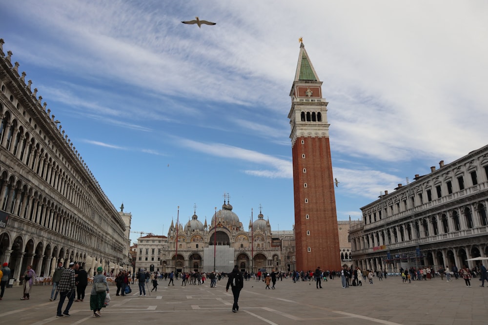 a very tall clock tower towering over a city