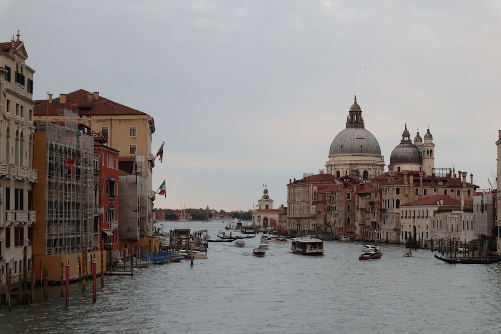 a waterway with boats and buildings on both sides