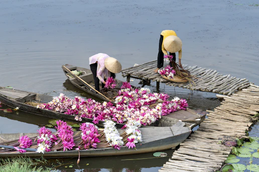 a couple of people on a boat with flowers