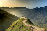 A breathtaking mountain landscape with a small group led by a guide