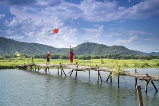 Children flying kites on a sunny day in Islamabad’s hills.