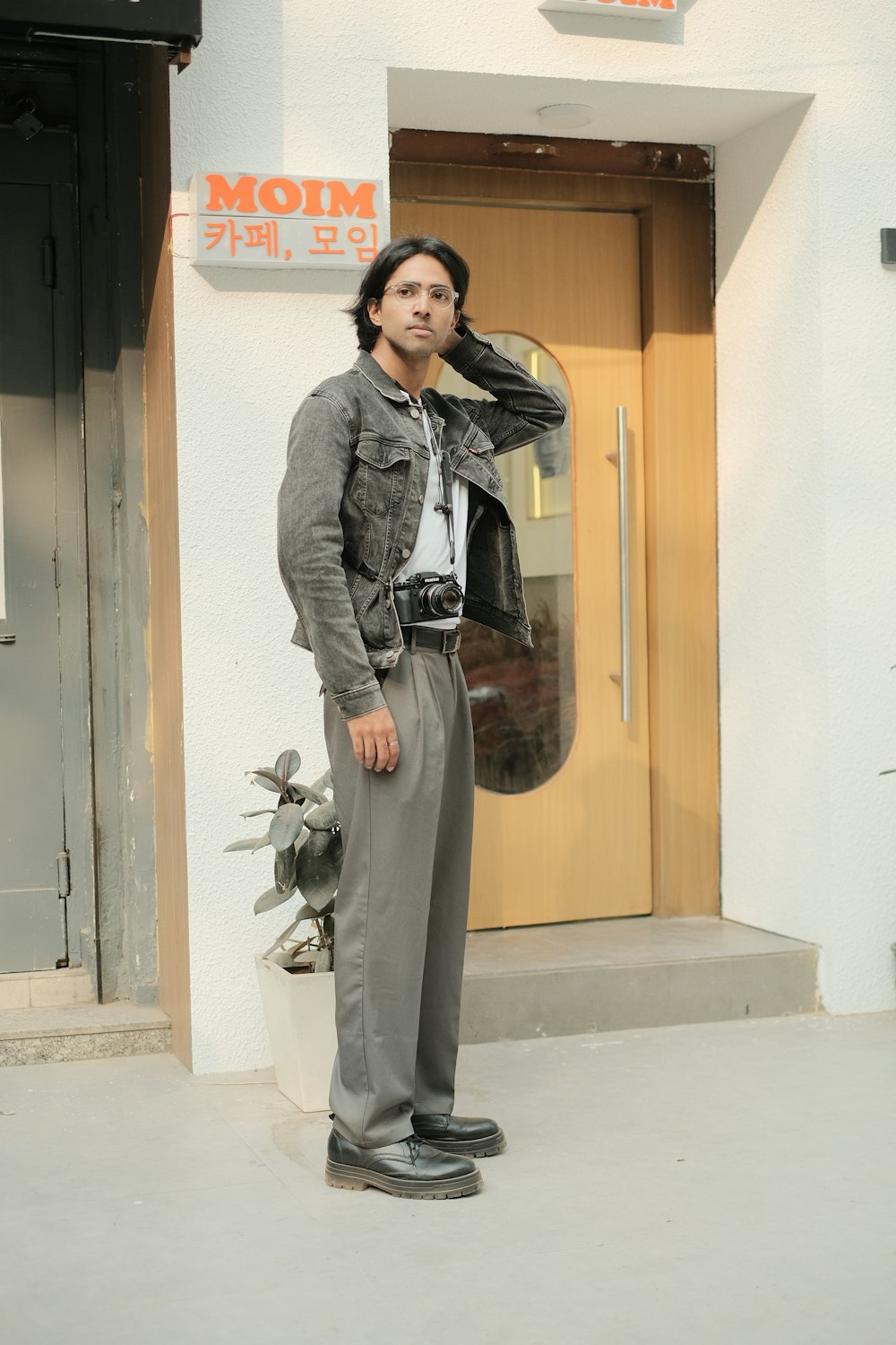 a man standing in front of a building