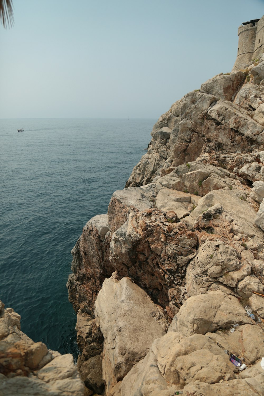 a view of the ocean from a rocky cliff