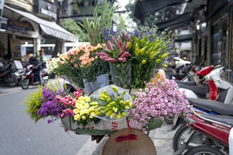 a bunch of flowers that are sitting on a bike