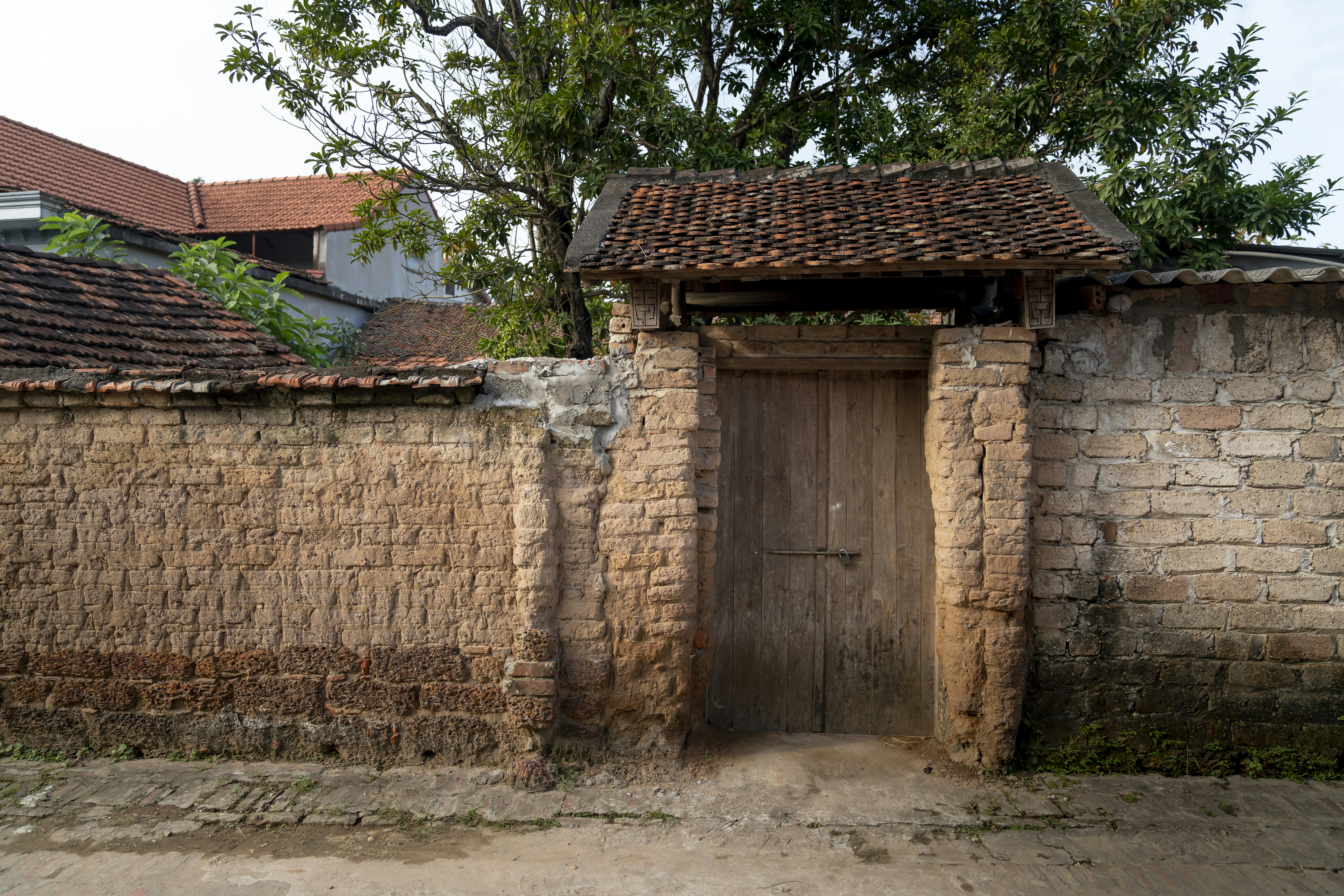 an old brick building with a wooden door