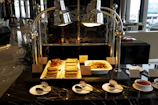 a table topped with plates and bowls of food
