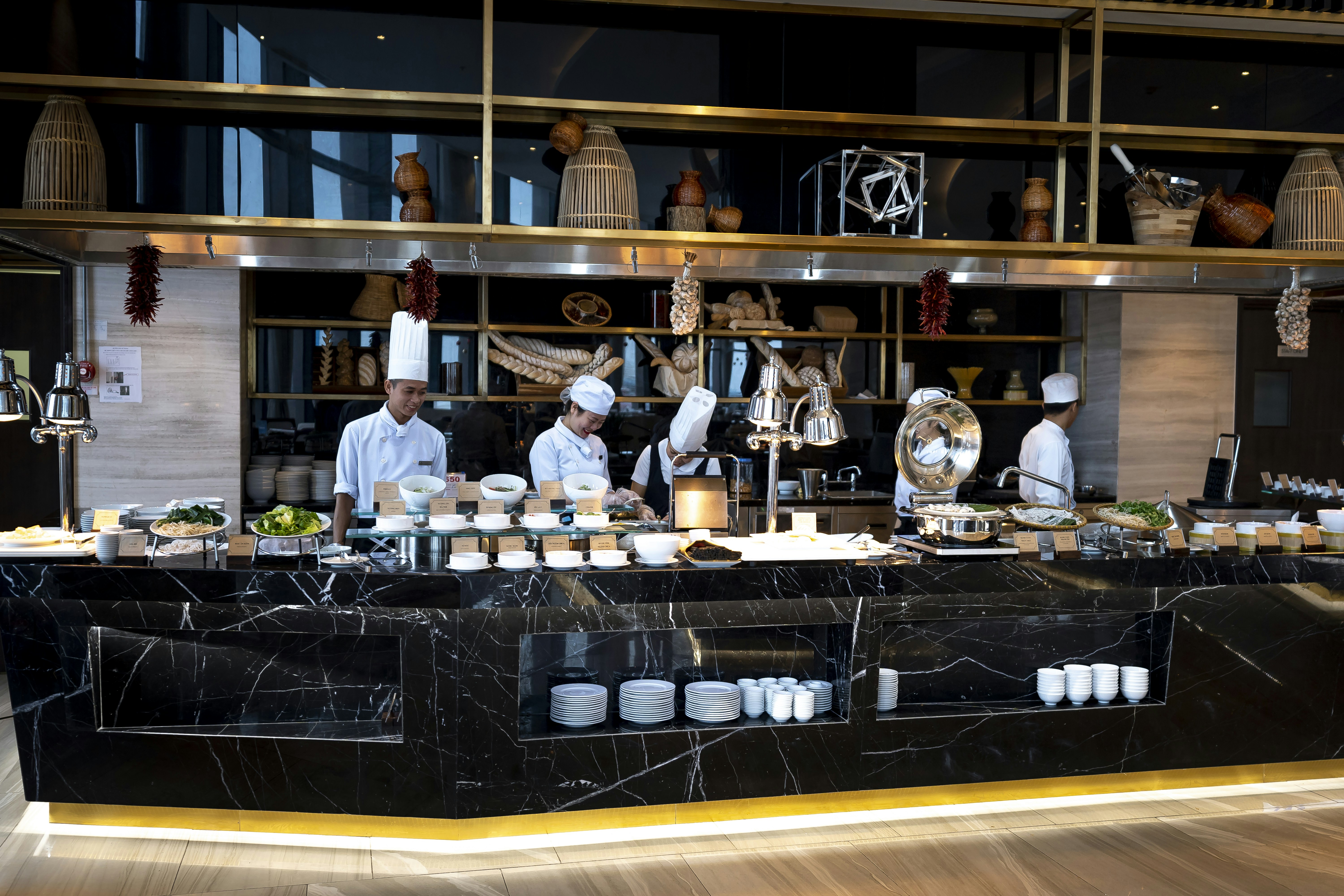 professional catering staff setting up a buffet line in an office space - corporate meeting catering