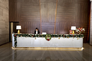 a woman sitting at a desk with a laptop