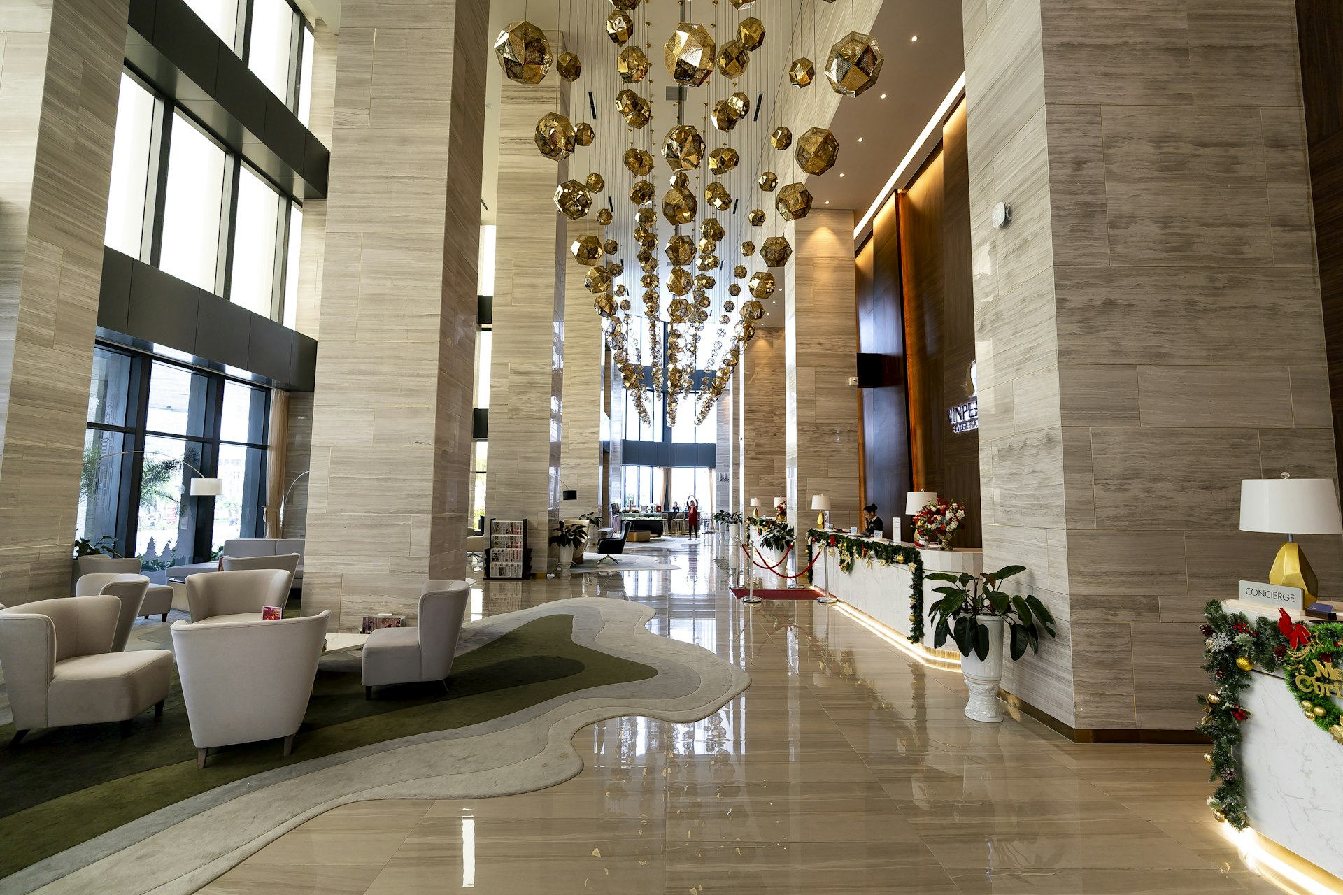 Luxury hotel lobby with elegant chandelier and modern furniture