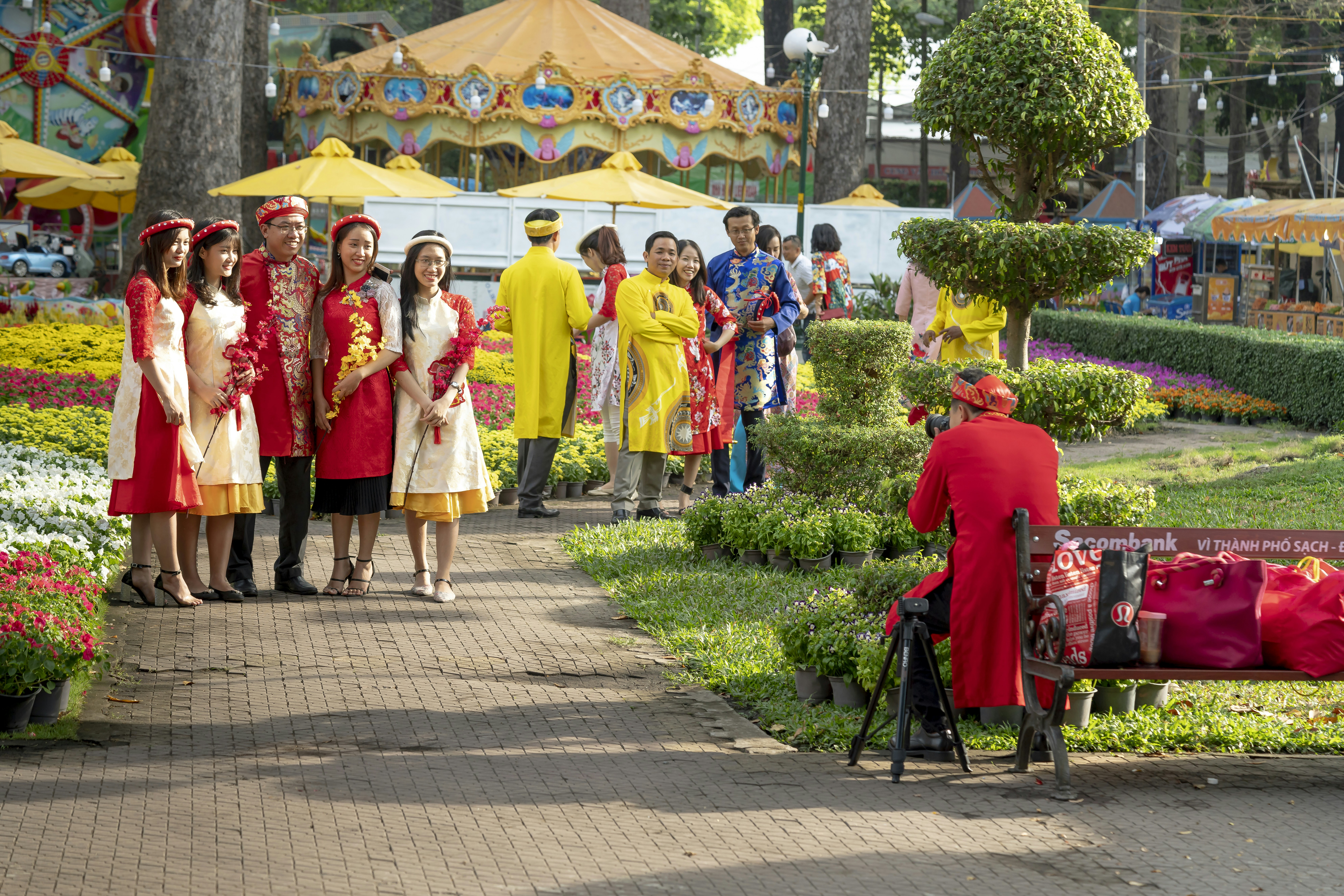 a group of people standing around a park