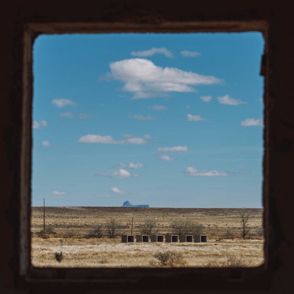 a view of a field through a window