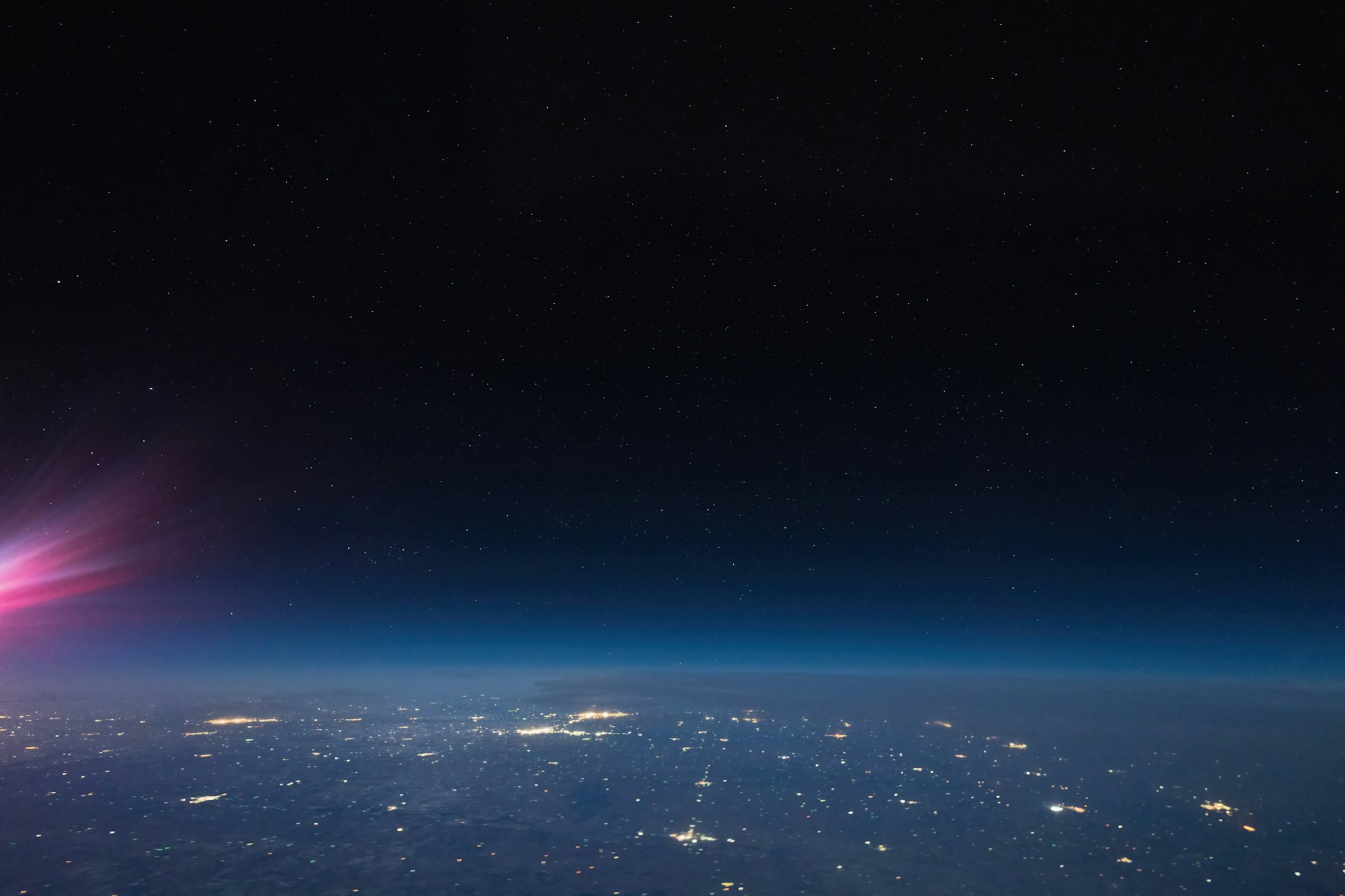 a view of the night sky from an airplane