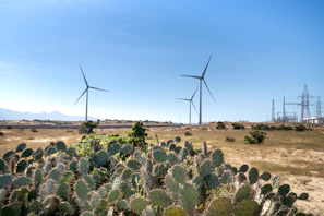 Aerial view of a remote energy site powered by turbines in the Permian Basin