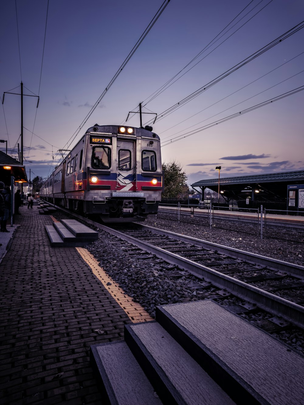 a train on a train track near a platform