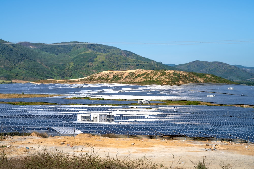 a large body of water filled with lots of solar panels