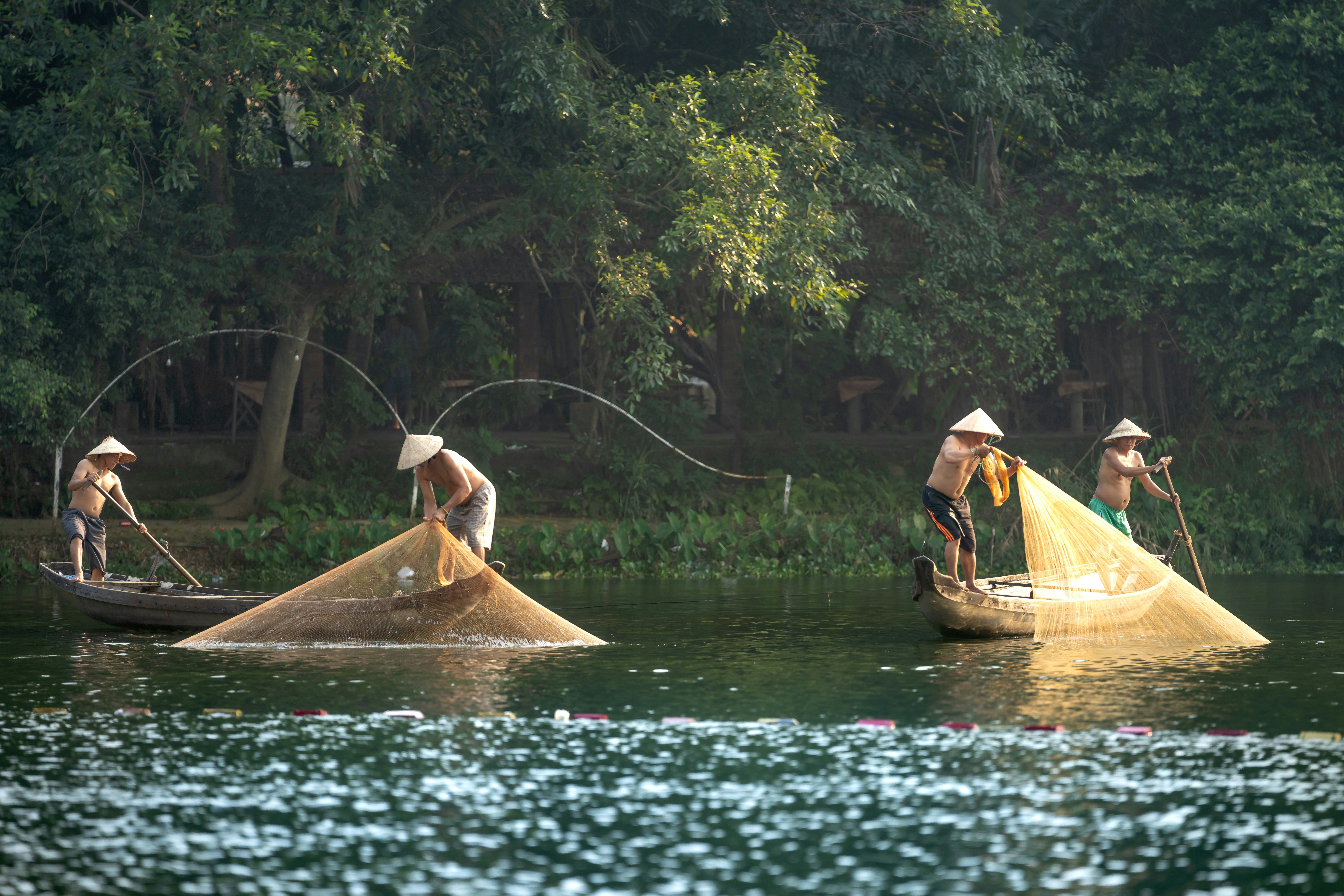 a group of people on small boats in the water