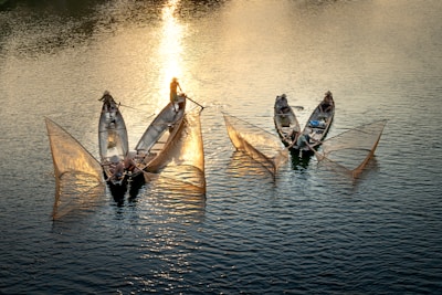 Local fishermen working at dawn on traditional boats along the Tumbes coastline.