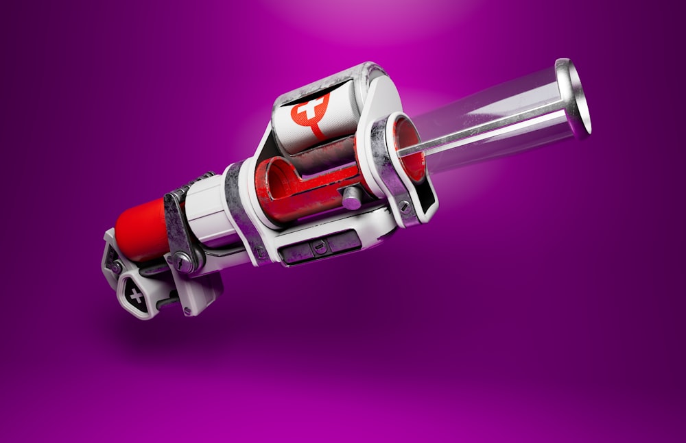 a close up of a red and white object on a purple background
