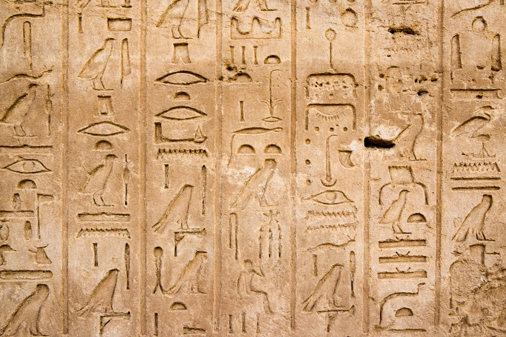 a wall with egyptian writing on it