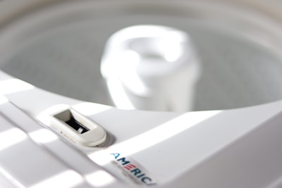 Close-up of a restored original washing machine part with visible brand markings.