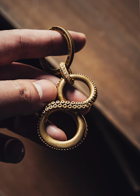 Close-up of a vibrant, handmade resin keychain with swirling colors and a glossy finish.